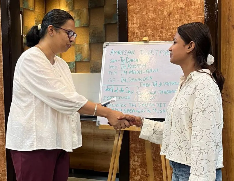 Two members shaking hands