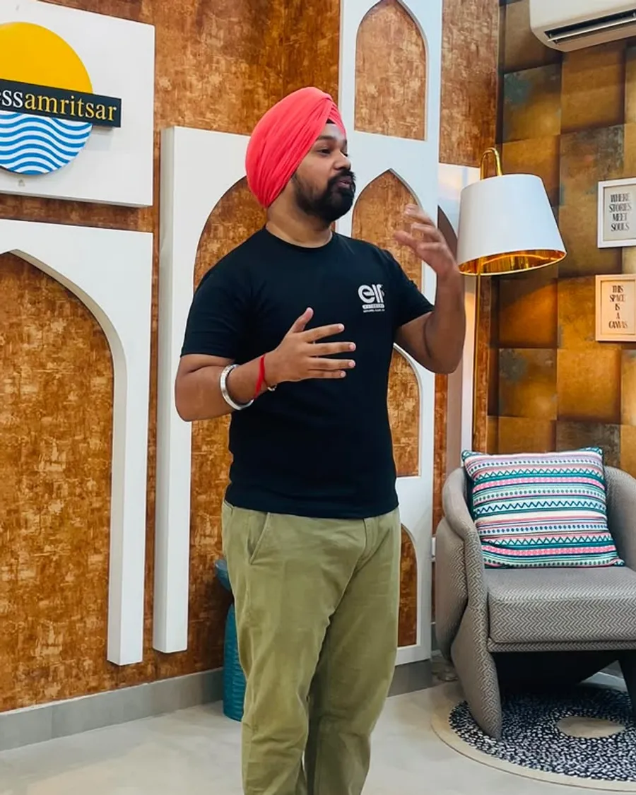 A member speaking and gesturing with his hands