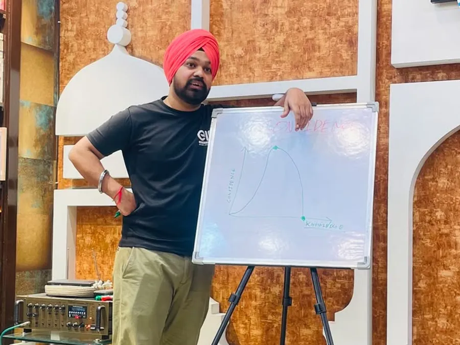 A member explaining a chart on a whiteboard
